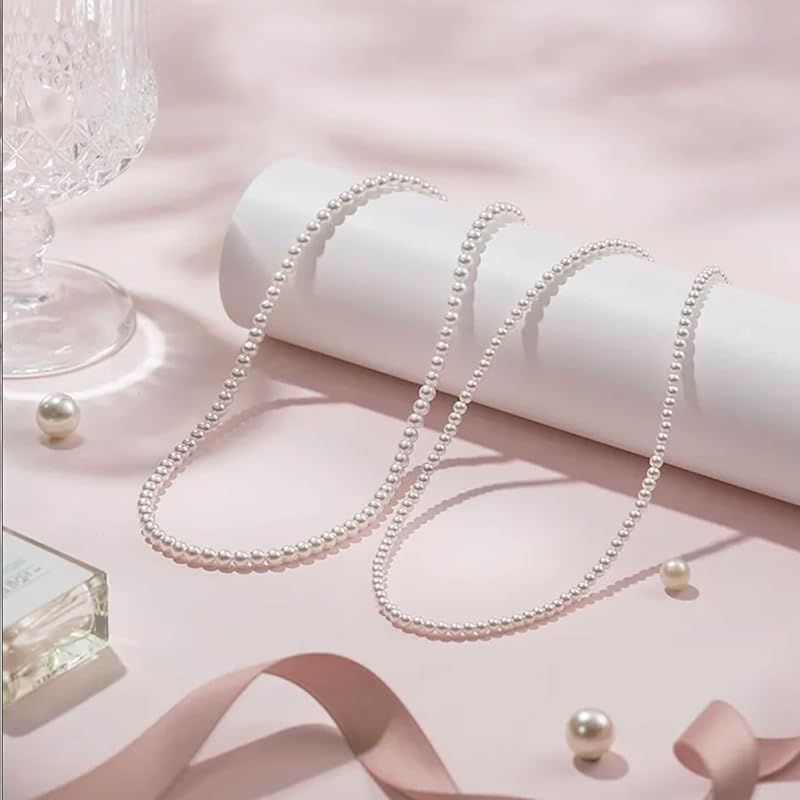 New Yachihoko Baby Pearl Necklace with 3-3.5 mm freshwater pearls and silver clasp on white background