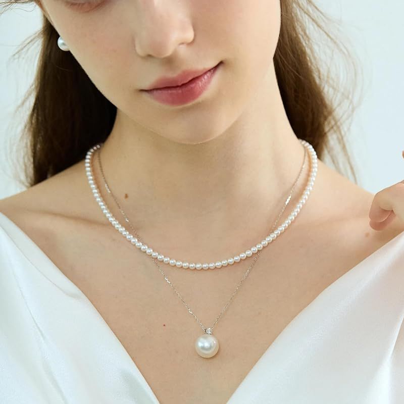 New Yachihoko Baby Pearl Necklace with 3-3.5 mm freshwater pearls and silver clasp on white background