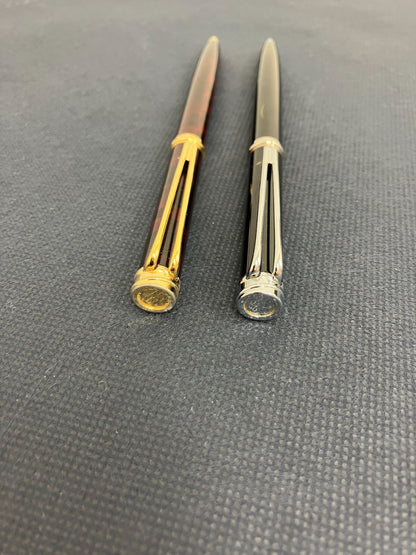 Waterman Harmonie ballpoint pen set with black twist pen and red marble twist pen, both 135mm long