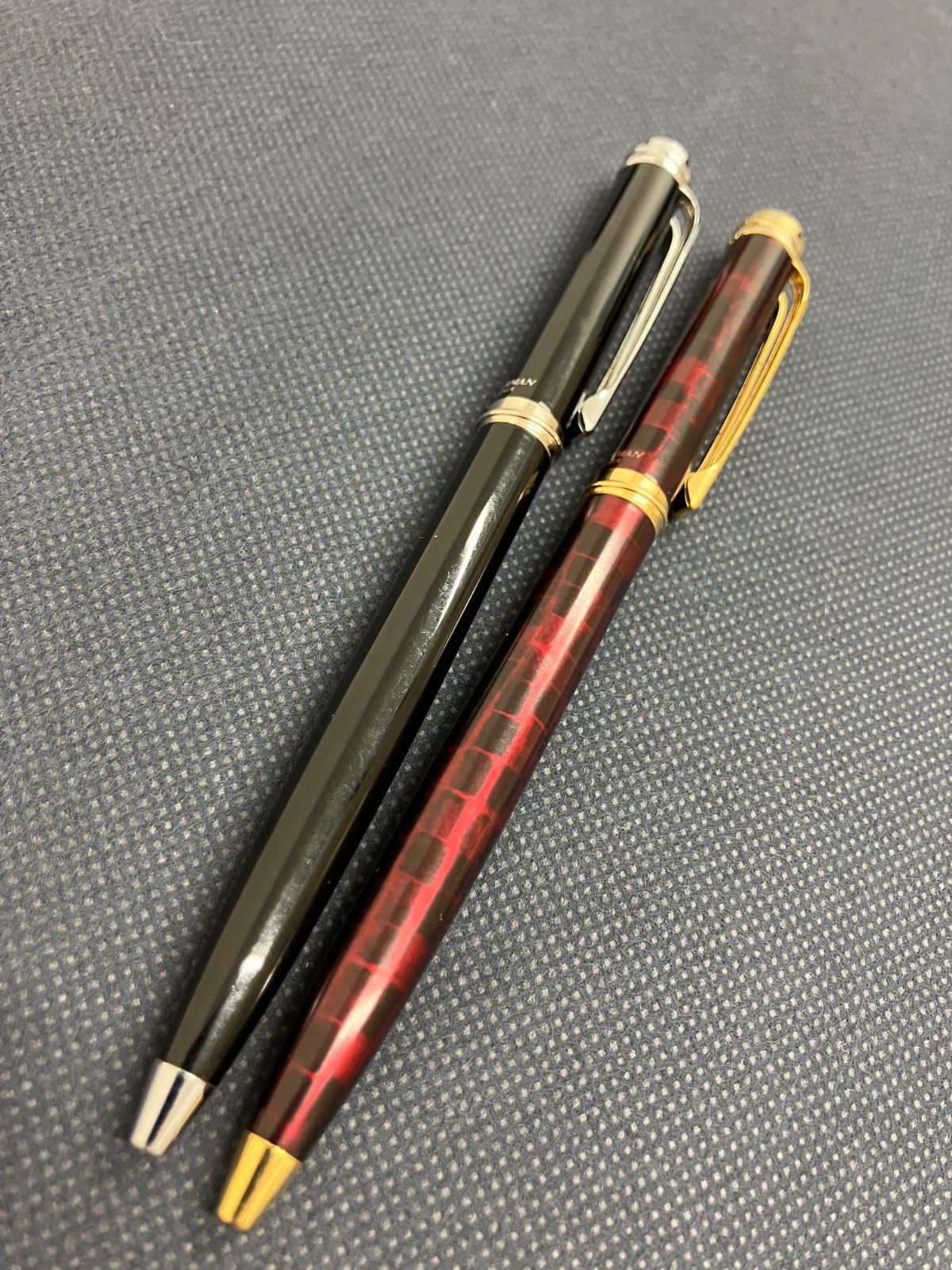 Waterman Harmonie ballpoint pen set with black twist pen and red marble twist pen, both 135mm long