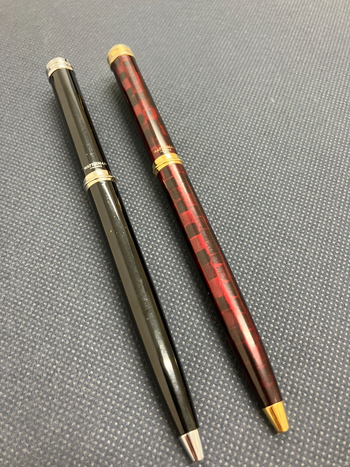 Waterman Harmonie ballpoint pen set with black twist pen and red marble twist pen, both 135mm long
