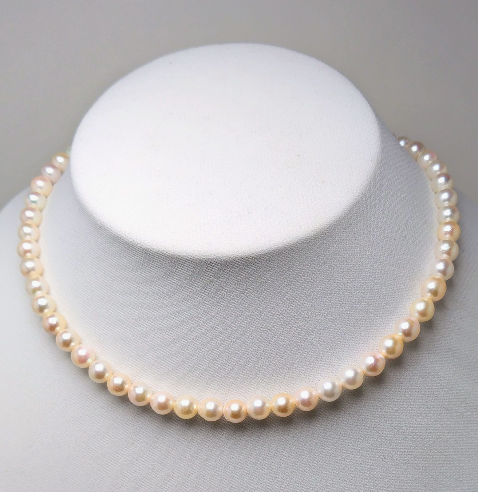 Akoya pearl necklace with 6.5 to 7.0 mm white pink semi-baroque pearls showing natural indentations and good luster