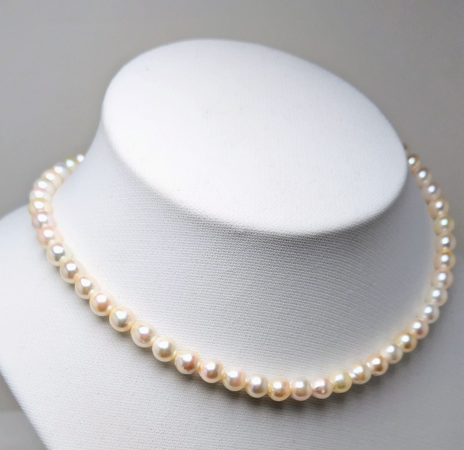 Akoya pearl necklace with 6.5 to 7.0 mm white pink semi-baroque pearls showing natural indentations and good luster