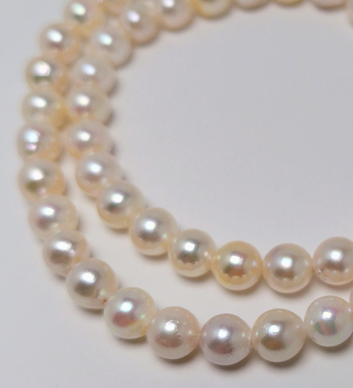 Akoya pearl necklace with 6.5 to 7.0 mm white pink semi-baroque pearls showing natural indentations and good luster