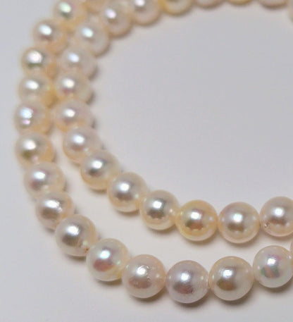 Akoya pearl necklace with 6.5 to 7.0 mm white pink semi-baroque pearls showing natural indentations and good luster