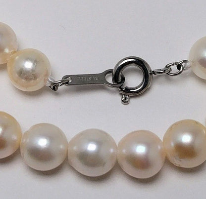 Akoya pearl necklace with 6.5 to 7.0 mm white pink semi-baroque pearls showing natural indentations and good luster