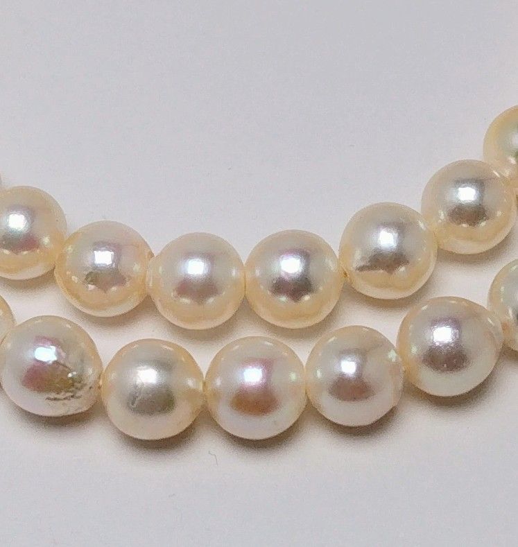 Akoya pearl necklace with 6.5 to 7.0 mm white pink semi-baroque pearls showing natural indentations and good luster