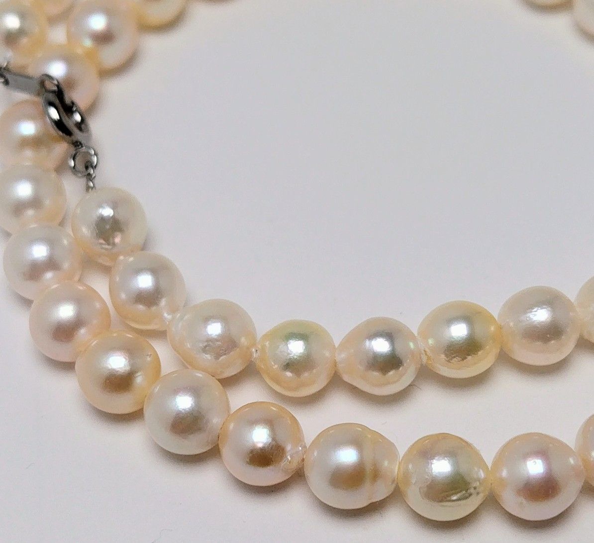 Akoya pearl necklace with 6.5 to 7.0 mm white pink semi-baroque pearls showing natural indentations and good luster