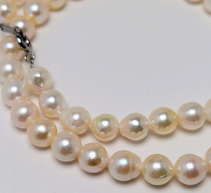 Akoya pearl necklace with 6.5 to 7.0 mm white pink semi-baroque pearls showing natural indentations and good luster