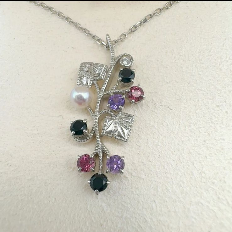 Mikimoto Akoya pearl necklace featuring amethyst, onyx, and tourmaline gemstones with 42cm chain length