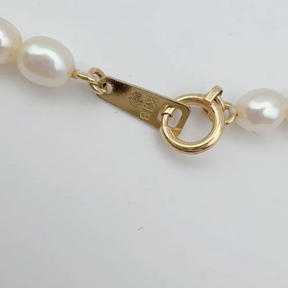 Tasaki pearl necklace with 4mm pearls, ruby gemstones, and K18 gold chain, 37cm length
