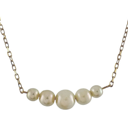 Mikimoto 18K yellow gold pearl necklace for ladies weighing 2.3 grams shown on white background
