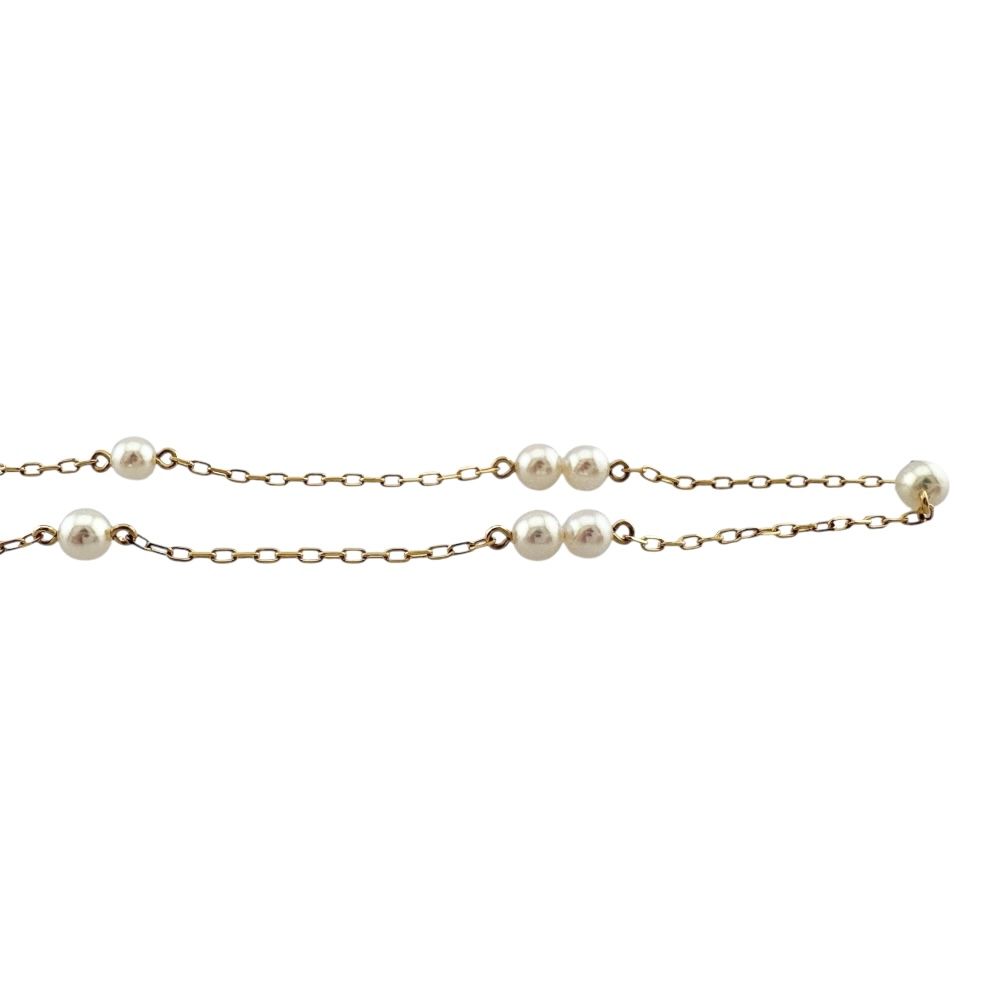 Mikimoto gold ladies necklace featuring a single pearl with K18 clasp stamp weighing 3.2 grams