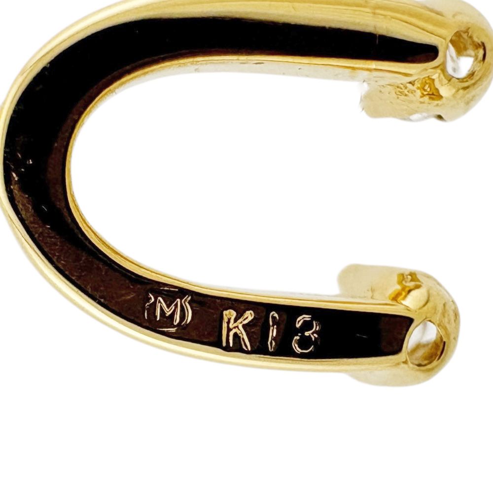 Mikimoto ladies necklace in 18K yellow gold featuring a diamond, weighing approximately 2.6g
