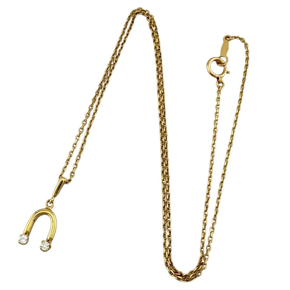 Mikimoto ladies necklace in 18K yellow gold featuring a diamond, weighing approximately 2.6g