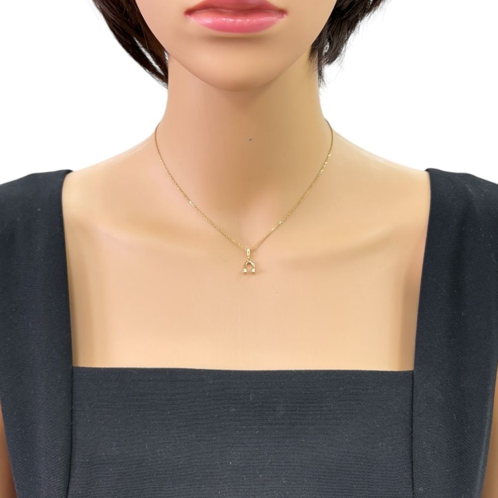 Mikimoto ladies necklace in 18K yellow gold featuring a diamond, weighing approximately 2.6g