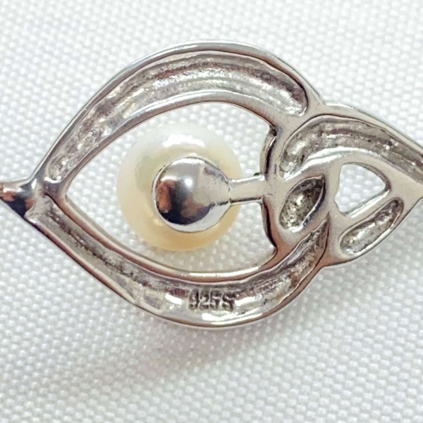 Mikimoto pearls necklace showing white pearls with slight cloudiness due to aging