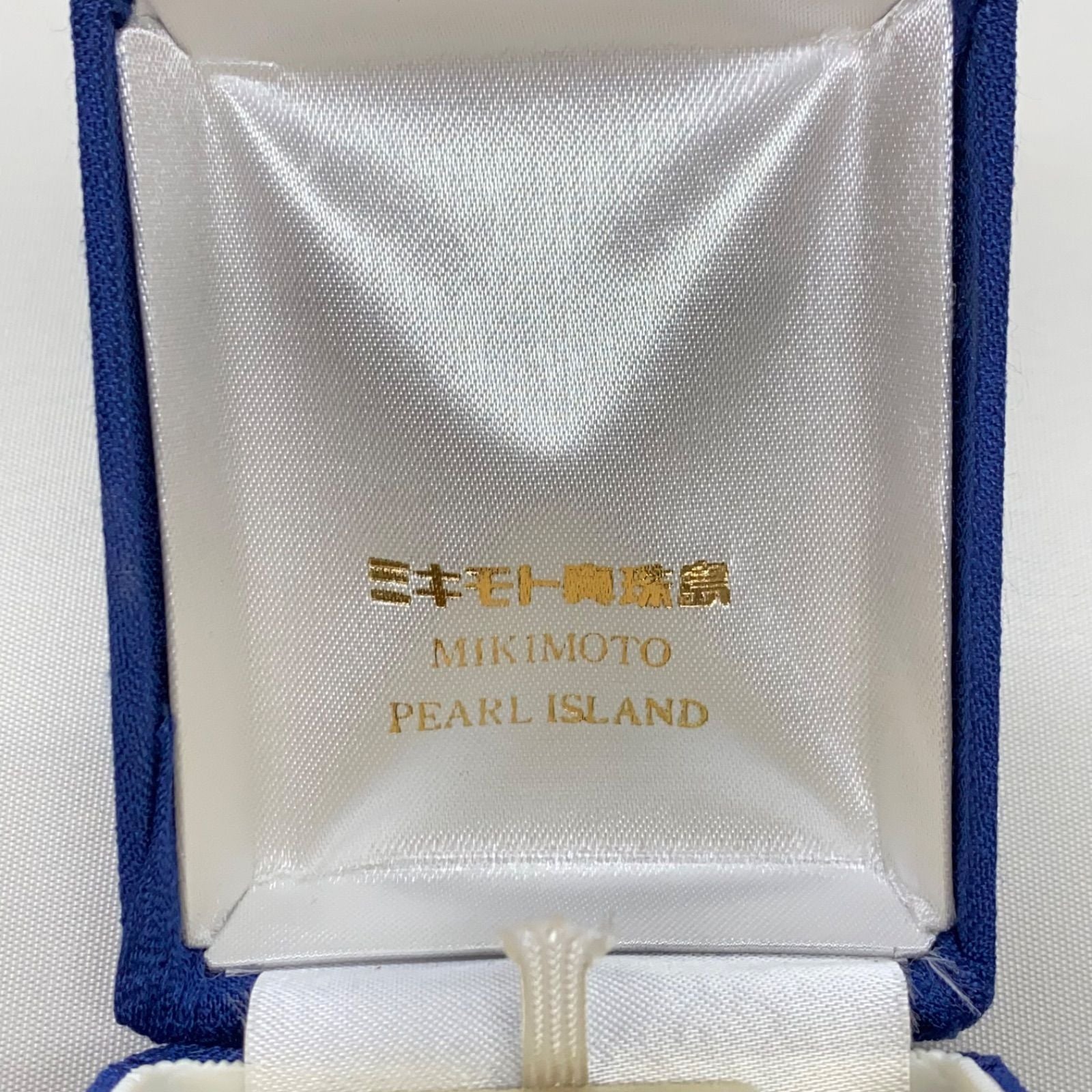Mikimoto pearls necklace showing white pearls with slight cloudiness due to aging