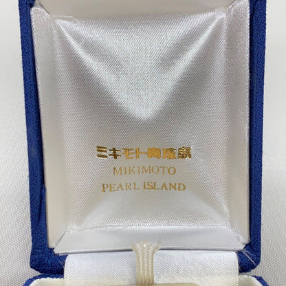 Mikimoto pearls necklace showing white pearls with slight cloudiness due to aging