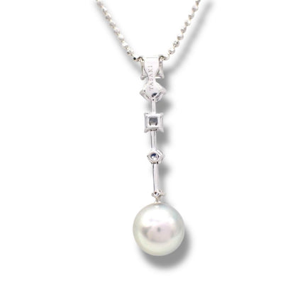 Tasaki pearl necklace with drop pendant featuring diamonds and colored gemstones on a white gold chain