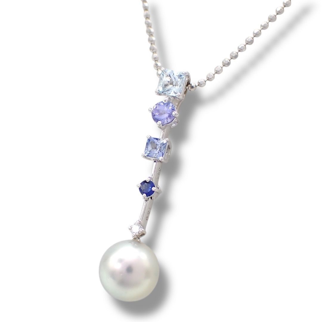 Tasaki pearl necklace with drop pendant featuring diamonds and colored gemstones on a white gold chain