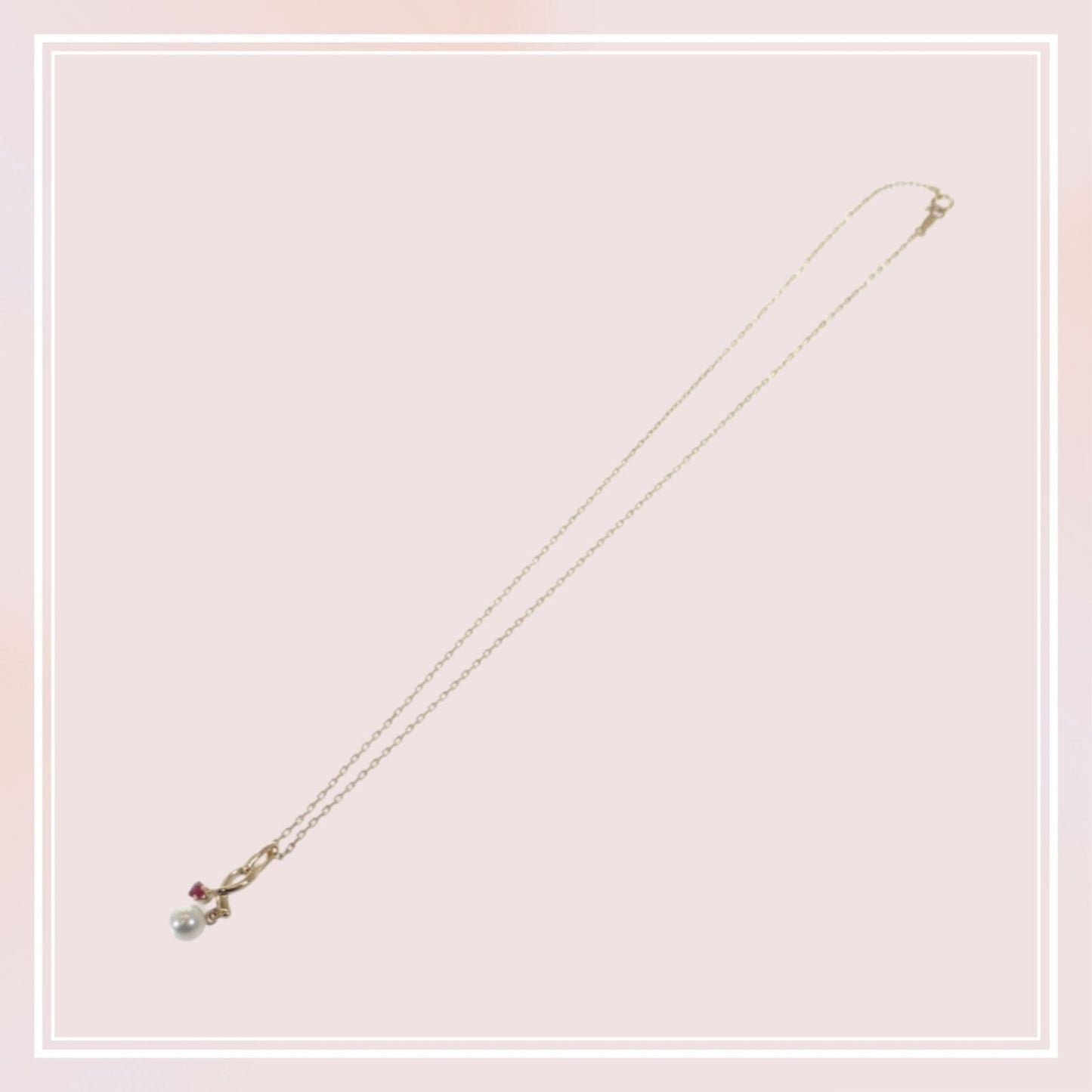 Mikimoto 18K yellow gold pendant necklace with ruby and 5.1mm Akoya pearl on 38cm chain displayed with box