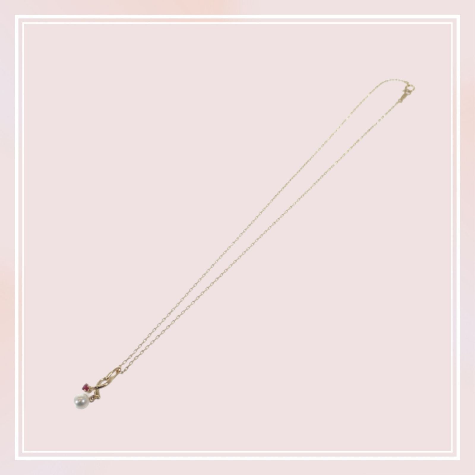 Mikimoto 18K yellow gold pendant necklace with ruby and 5.1mm Akoya pearl on 38cm chain displayed with box