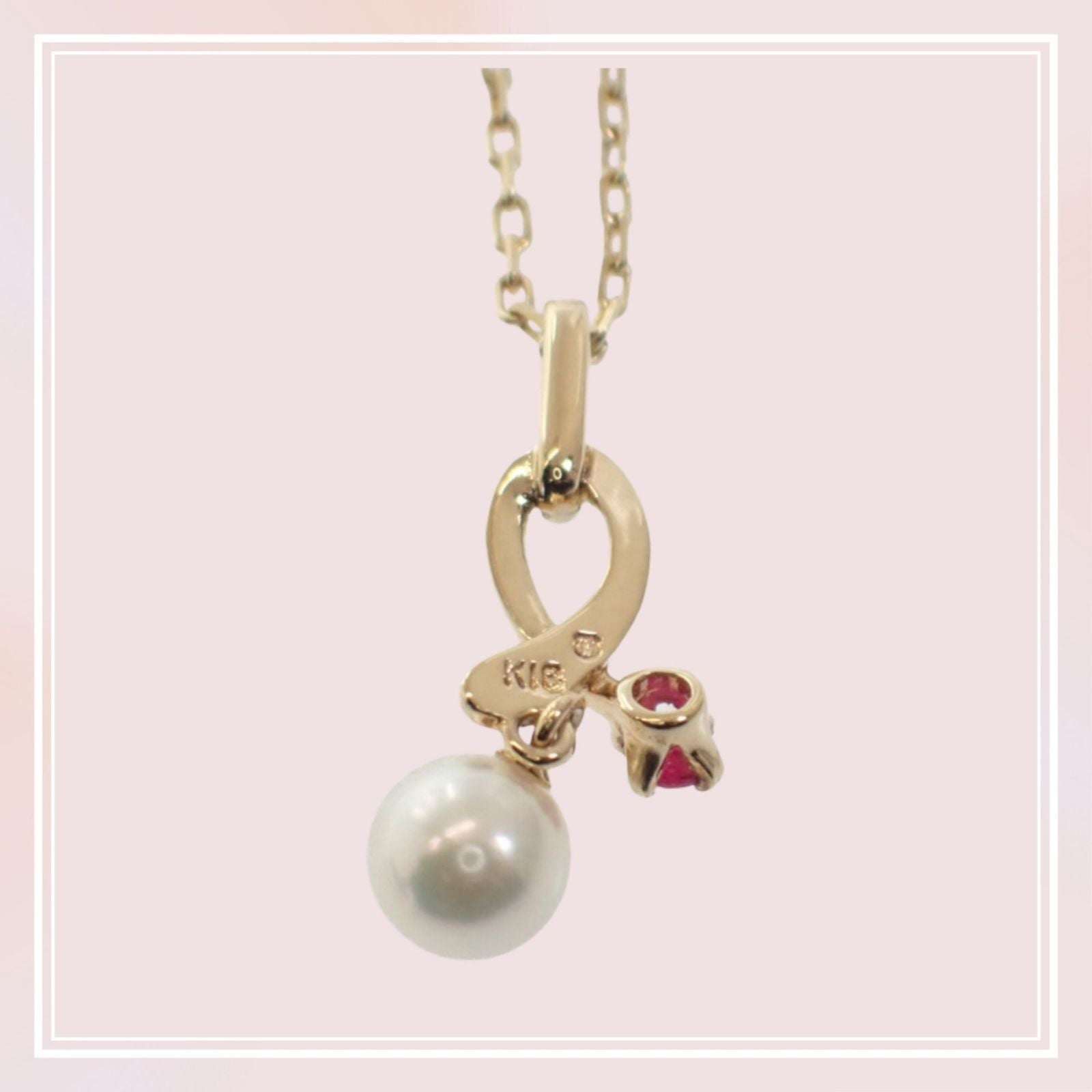 Mikimoto 18K yellow gold pendant necklace with ruby and 5.1mm Akoya pearl on 38cm chain displayed with box