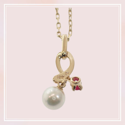 Mikimoto 18K yellow gold pendant necklace with ruby and 5.1mm Akoya pearl on 38cm chain displayed with box