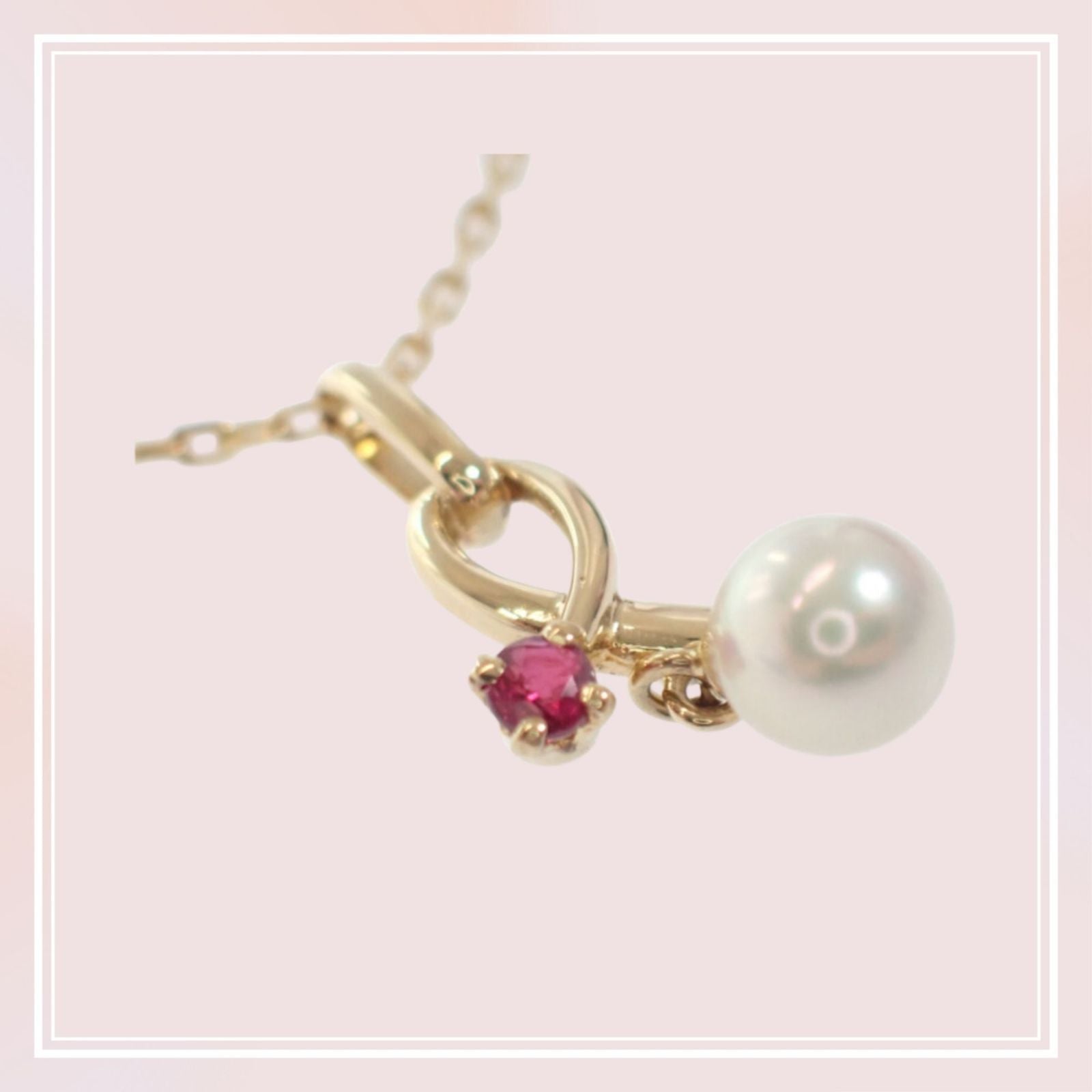 Mikimoto 18K yellow gold pendant necklace with ruby and 5.1mm Akoya pearl on 38cm chain displayed with box