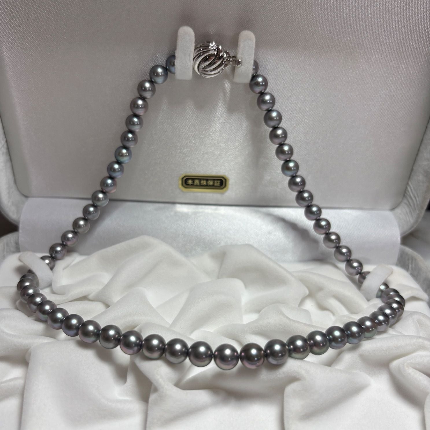 Akoya genuine pearl necklace in gray with mixed navy and purple tones, paired with silk Juzu bracelet