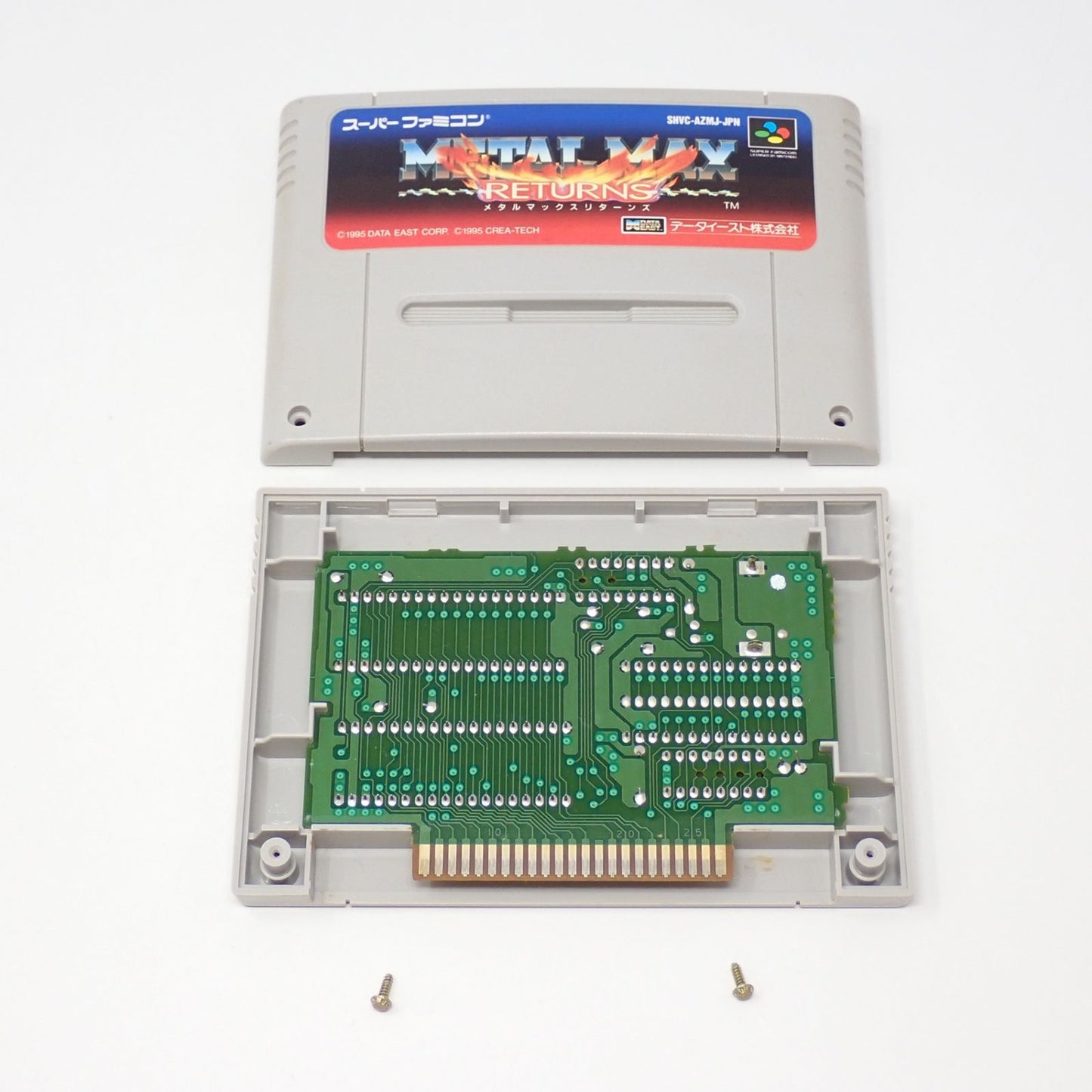 Meta Max Returns SNES game cartridge with original box, manual, and postcard in used condition