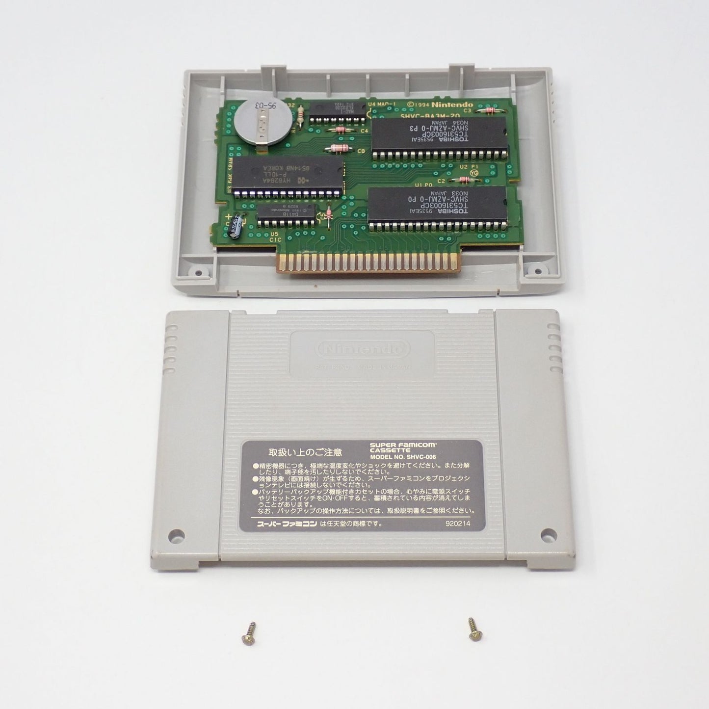 Meta Max Returns SNES game cartridge with original box, manual, and postcard in used condition