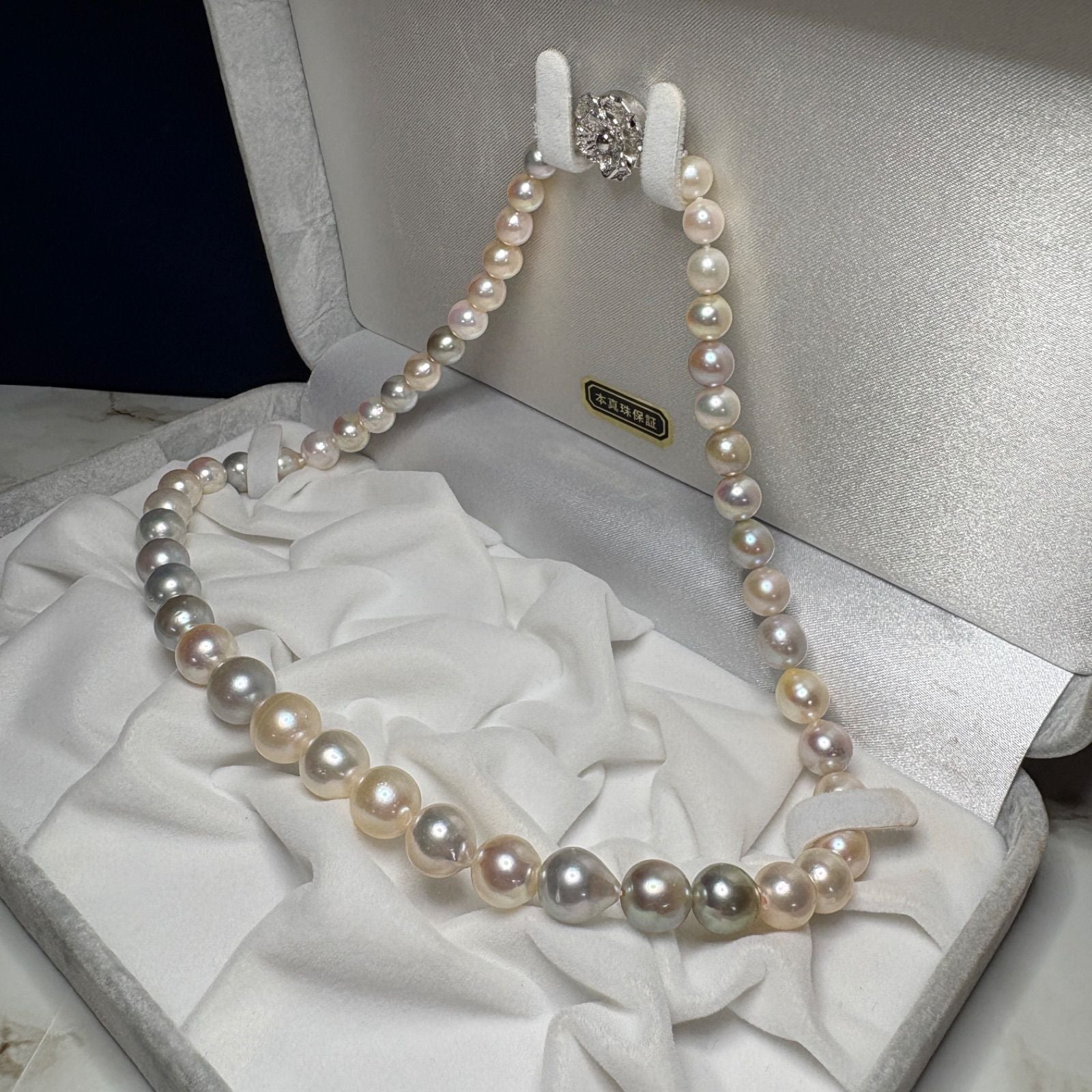 Akoya genuine pearl necklace with multi-gradient 6-10mm narrow drop pearls and silver fittings on a 43cm chain