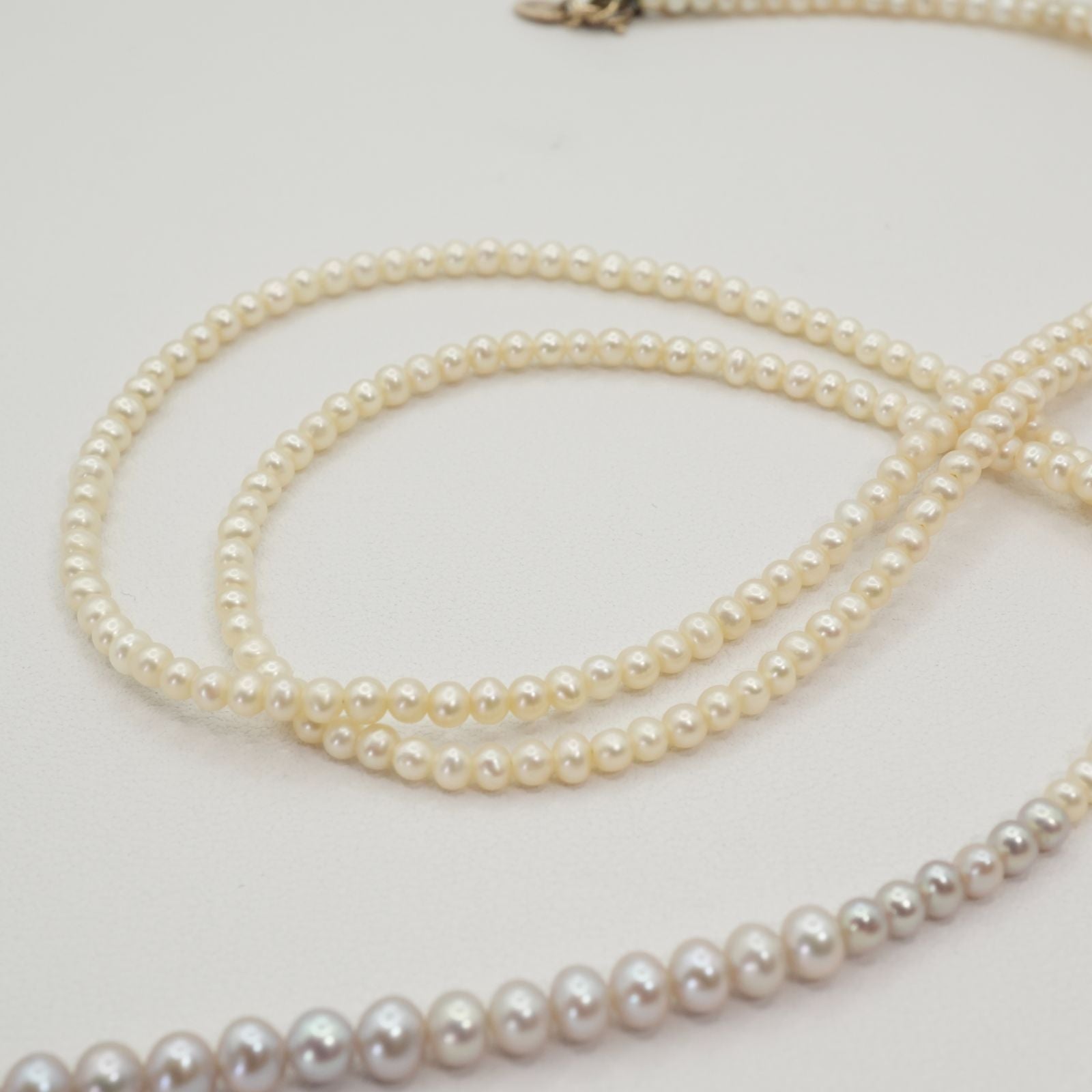 Agete K10 Pearl Long Necklace 25-2801 featuring delicate pearl accents on a fine gold chain