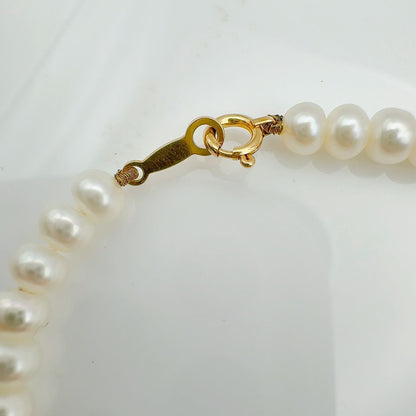 MIKIMOTO freshwater pearl necklace with 3x5mm pearls and K18 gold clasp measuring 42cm in length