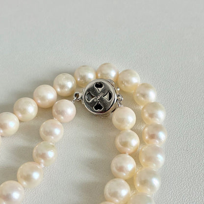 Akoya pearl necklace with 7.1-7.4mm round pearls and 43cm silver chain displayed on white background