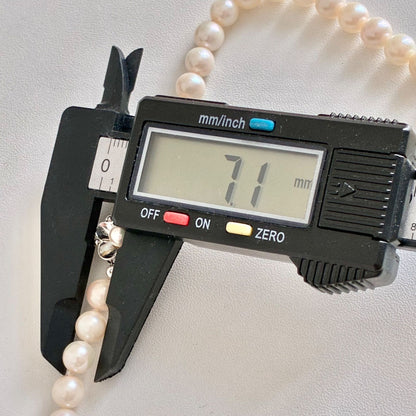 Akoya pearl necklace with 7.1-7.4mm round pearls and 43cm silver chain displayed on white background