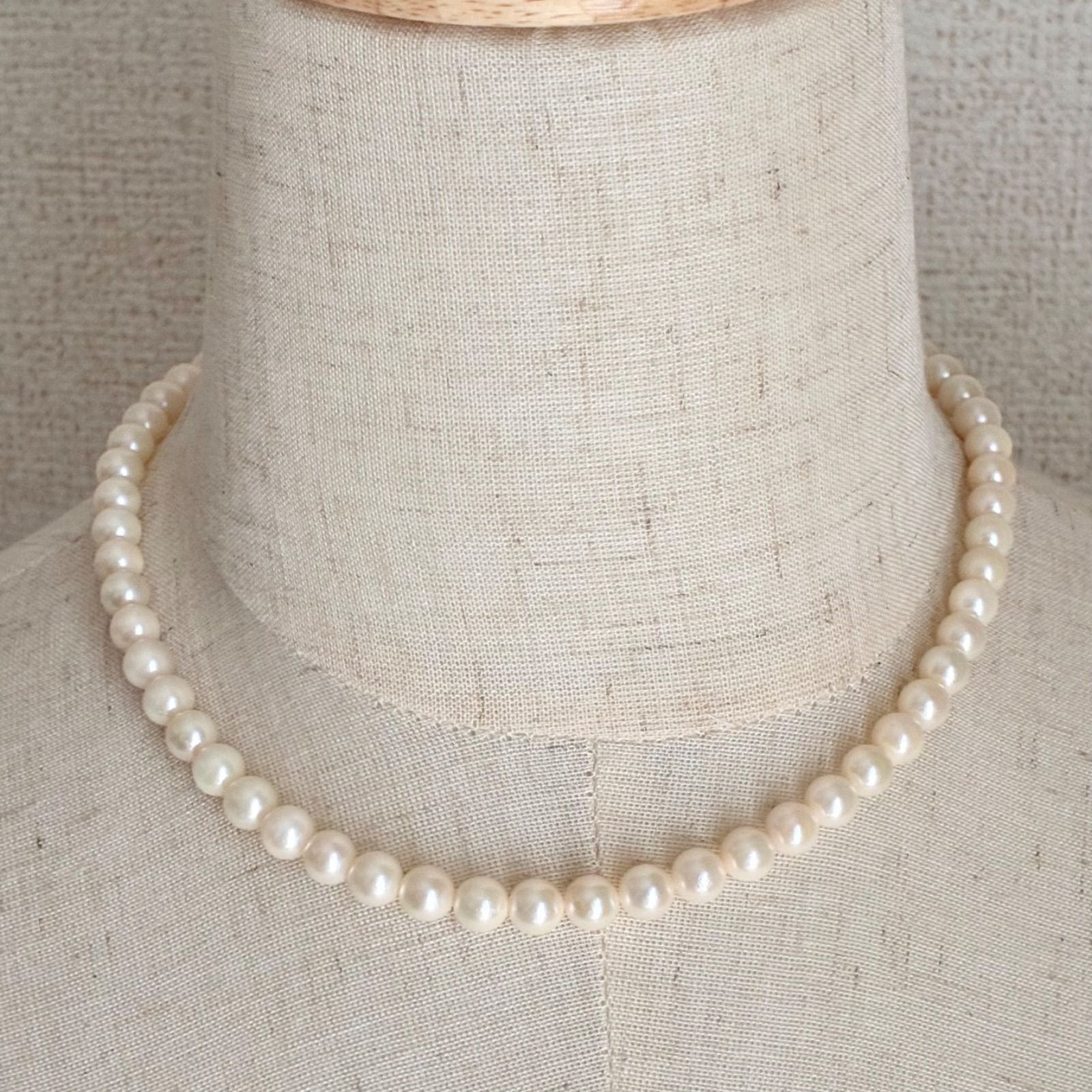 Akoya pearl necklace with 7.1-7.4mm round pearls and 43cm silver chain displayed on white background