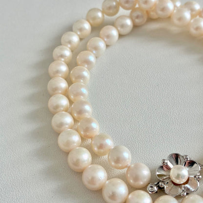 Akoya pearl necklace with 7.1-7.4mm round pearls and 43cm silver chain displayed on white background