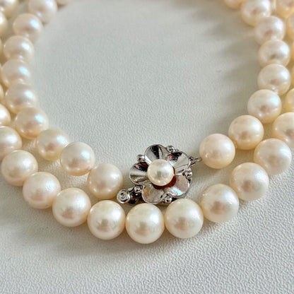Akoya pearl necklace with 7.1-7.4mm round pearls and 43cm silver chain displayed on white background