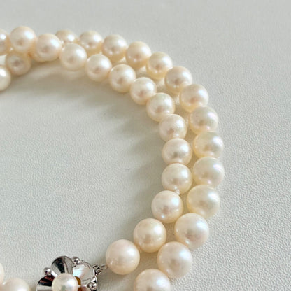 Akoya pearl necklace with 7.1-7.4mm round pearls and 43cm silver chain displayed on white background