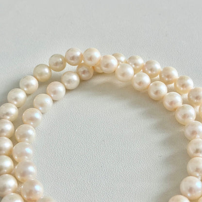Akoya pearl necklace with 7.1-7.4mm round pearls and 43cm silver chain displayed on white background