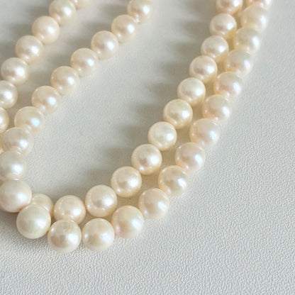 Akoya pearl necklace with 7.1-7.4mm round pearls and 43cm silver chain displayed on white background