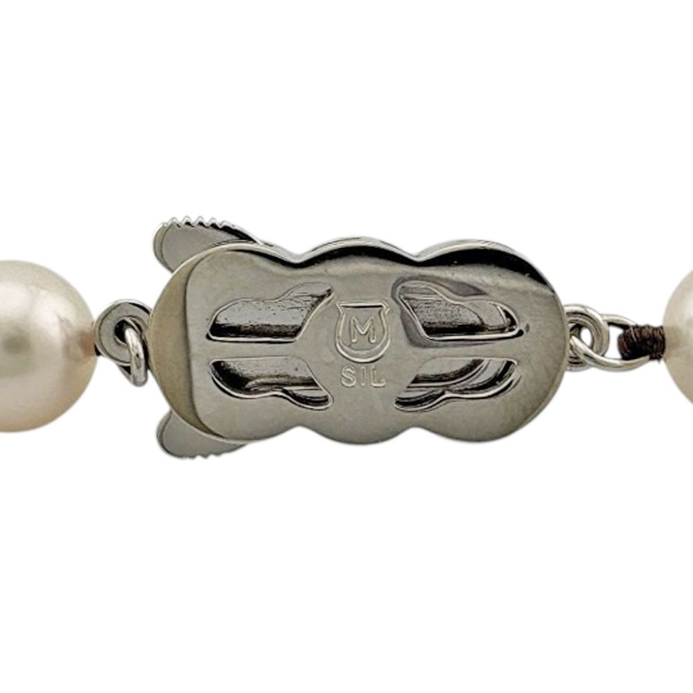 Mikimoto silver pearl necklace for ladies with elegant design, weighing 32.7 grams