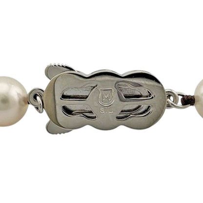 Mikimoto silver pearl necklace for ladies with elegant design, weighing 32.7 grams