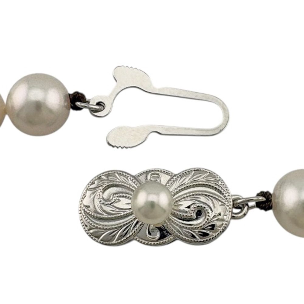 Mikimoto silver pearl necklace for ladies with elegant design, weighing 32.7 grams