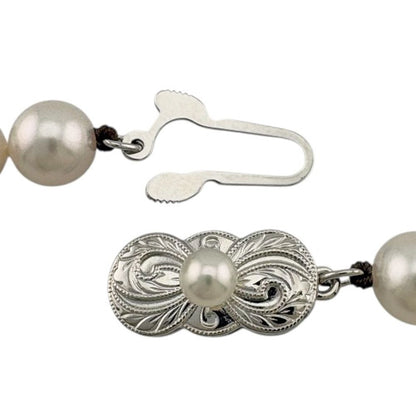 Mikimoto silver pearl necklace for ladies with elegant design, weighing 32.7 grams