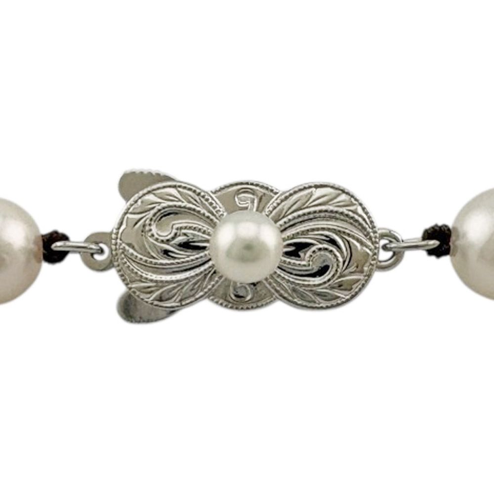 Mikimoto silver pearl necklace for ladies with elegant design, weighing 32.7 grams