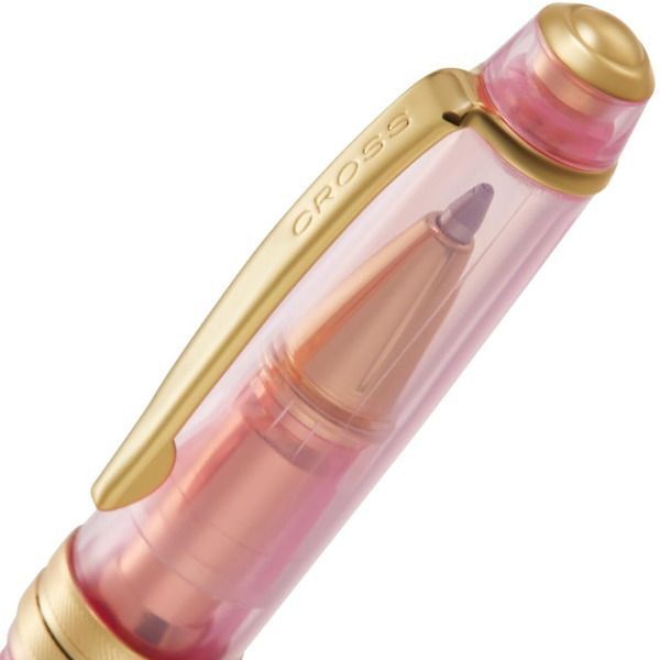 CROSS Bailey Light Cream Soda ballpoint pen in light cream with strawberry accents, capped and shown writing